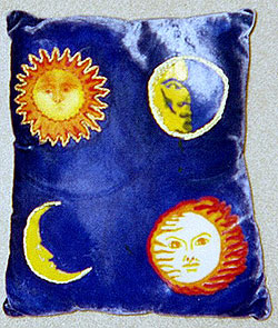 hand painted pillow with sun and moons