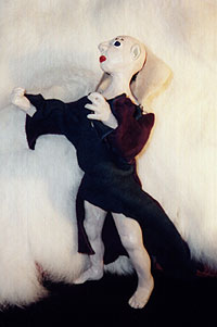 Sculpey elfin figure with leather shirt.